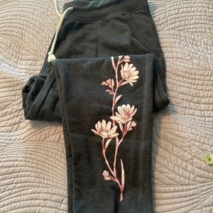 NWOT joggers with flower appliqué